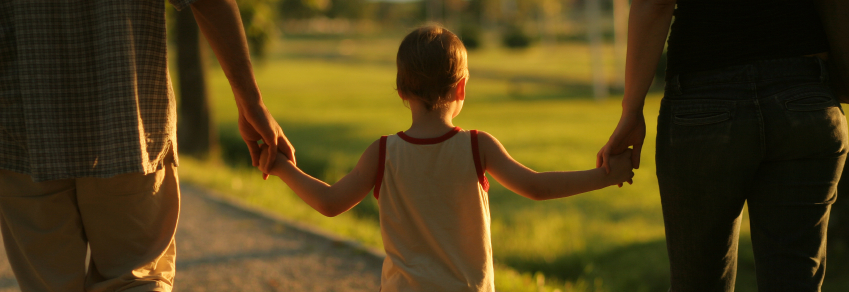 Family walking with child