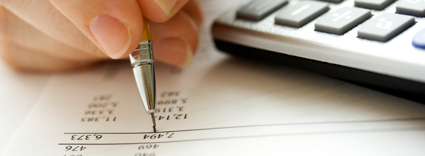 Banker reviewing balance sheet